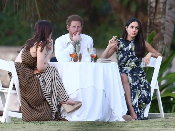 Prince Harry went to Jamaica in order to attend the wedding ceremony of the couple Tom Inskip and Lara Hughes-Young. Meghan Markle wore a bird printed silk maxi dress by Erdem Pre fall 2017 collection