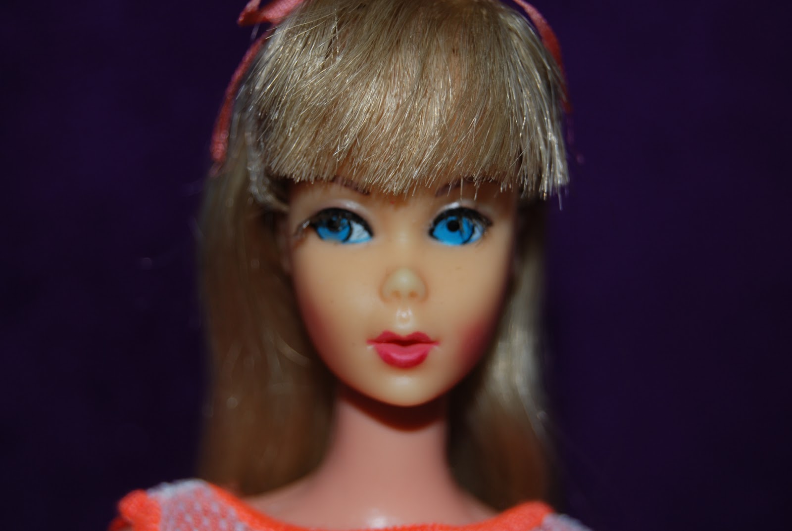 Twist n' Turn Barbie - Summer Sand Barbie is wearing a gro