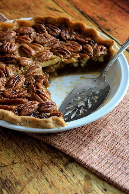 Maple Pecan Pie, a sweet, deep flavor of maple syrup complementing the richness of pecans in a classic pecan pie.  Perfect for any Thanksgiving meal!