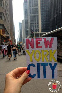 watercolor painting with NYC street in background