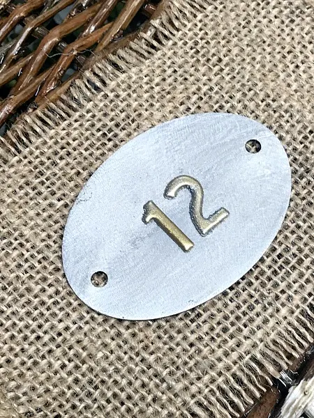 metal tag on burlap number 12