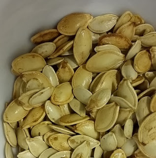 Picture of pumpkin seeds picked out of Halloween pumpkin flesh