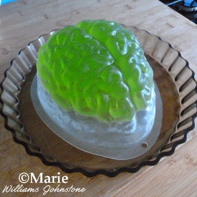 Jello or jelly set into a plastic mold and turned over onto a glass dish