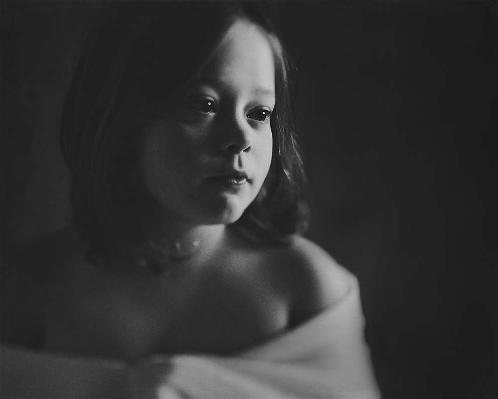 fine art black and white film portrait of a girl captured with a tilt shift lens