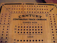 5-inch by 7-inch maple game board with holes for pegs used to tally scores.