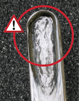 eroded glass in liquid level gages
