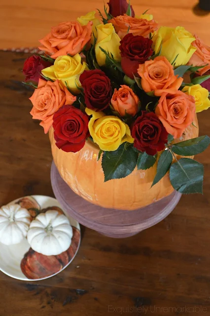 DIY Pumpkin Vase For Fall with roses and baby pumpkins