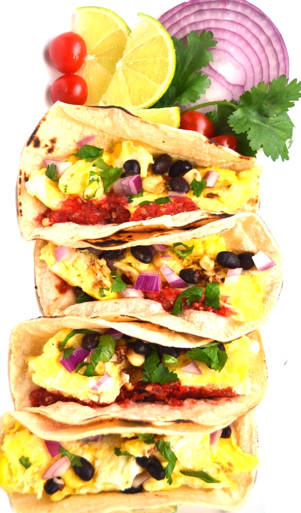 Breakfast Tacos with Fresh Tomato Salsa are ready in 10-minutes and are filled with scrambled eggs, black beans and homemade, flavorful salsa made with garden fresh tomatoes! www.nutritionistreviews.com