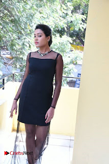 Actress Aswini Stills in Black Dress at Aavu Puli Madhyalo Prabhas Pelli Press Meet  0015