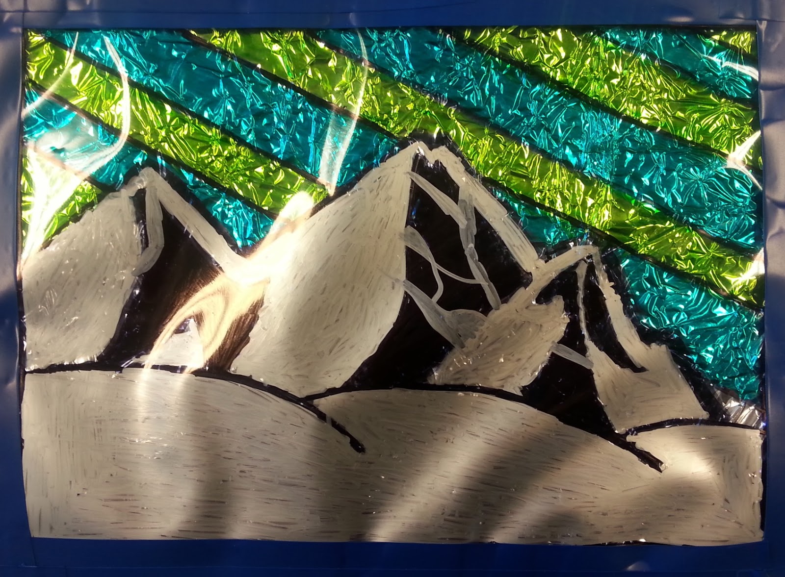 a faithful attempt Faux Stained Glass using Aluminum Foil and Sharpies