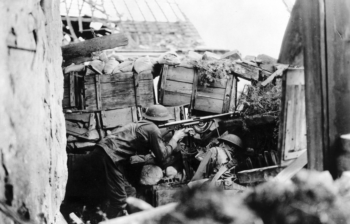 Original caption: Automatic rifle team ready for action. Manned by Pvt. J.H. Maxwell and Pvt. E.A. Sullivan, Co. B, 137th Infantry Regiment, near [unintelligible] Germany. Aug. 1918.