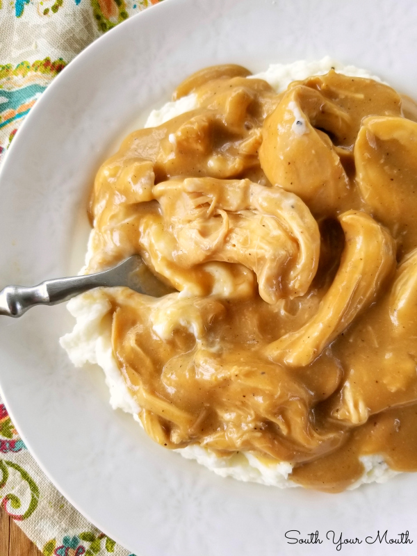Crock Pot Chicken & Gravy | An easy and delicious slow cooker recipe for tender chicken with savory gravy perfect served over mashed potatoes, noodles or rice.