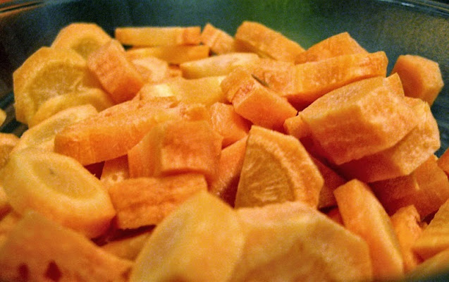 A bowl of chopped raw carrots, ready to be pressure-canned.