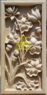 Relief dari batu alam paras jogja / batu putih motif bunga lotus