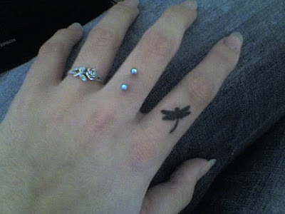 Retsis_tattoo_on_my_finger_by_happyhippybassist