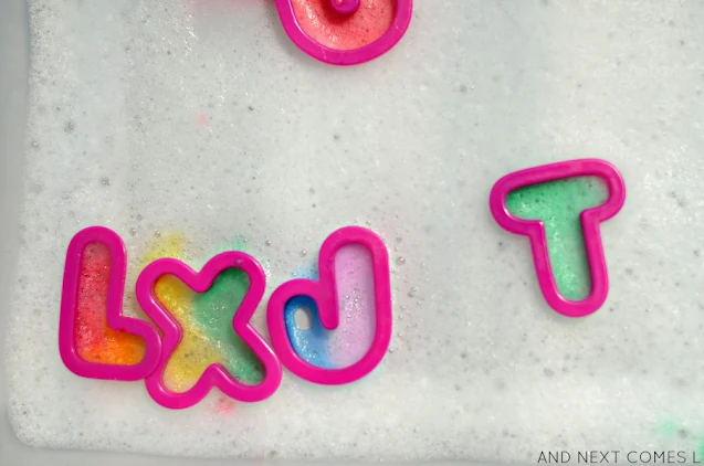 Soap foam letter painting with cookie cutters and liquid watercolors