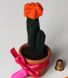 http://www.craftsy.com/pattern/crocheting/home-decor/orangecactus-english/56523