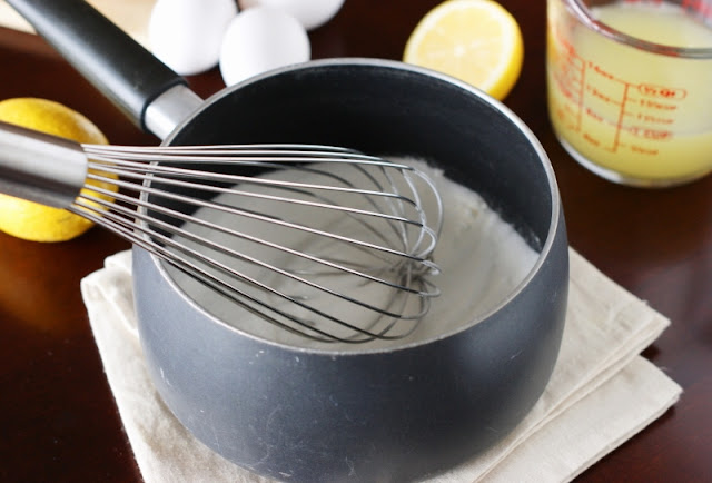 Whisking Ingredients to Make Lemon Curd Image