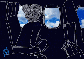 woman on plane looking out window traveling