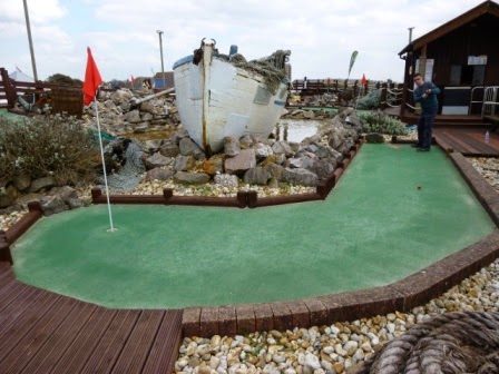 Playing hole one of the Sharksville Adventure Golf