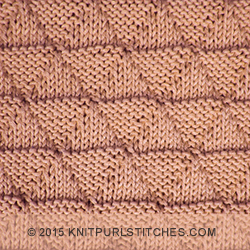 This knit and purl pattern creates a textured fabric made up of knit triangles and purl pyramids on one side and knit pyramids and purl triangles on the other.