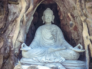 Buddha Statue Meditation In The Cave At Buddhist Monastery Bali Indonesia