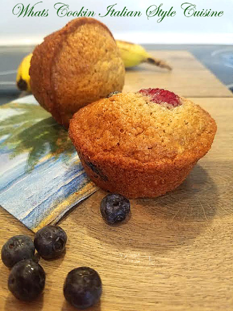  These are a summer blend of fruits with berries Muffins They are a quick bread with banana, raspberries and blueberries. Golden brown sweet muffins with fresh fruits and on a tropical palm tree plate