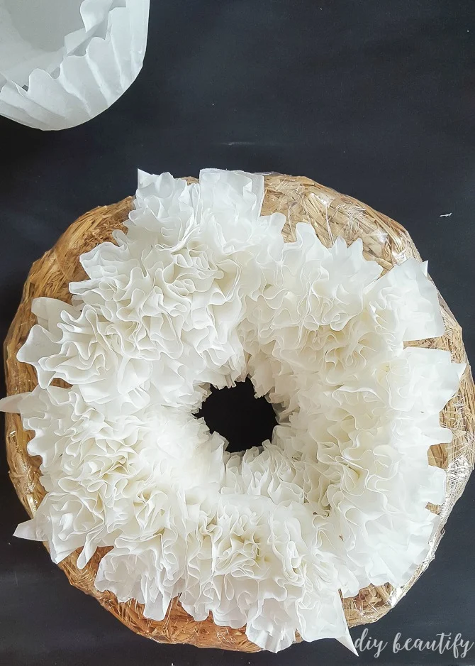 continue hot gluing coffee filter florets to wreath base