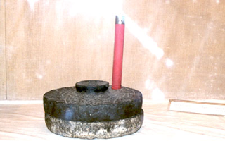 Pestle stone used by Baba for grinding