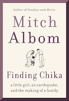 The white book cover has the author's name in large print above a sketch of Chika, Mitch, and his wife with the title near the bottom.