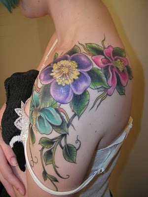 Tattoo images with flowers signify the woman's beauty and charm