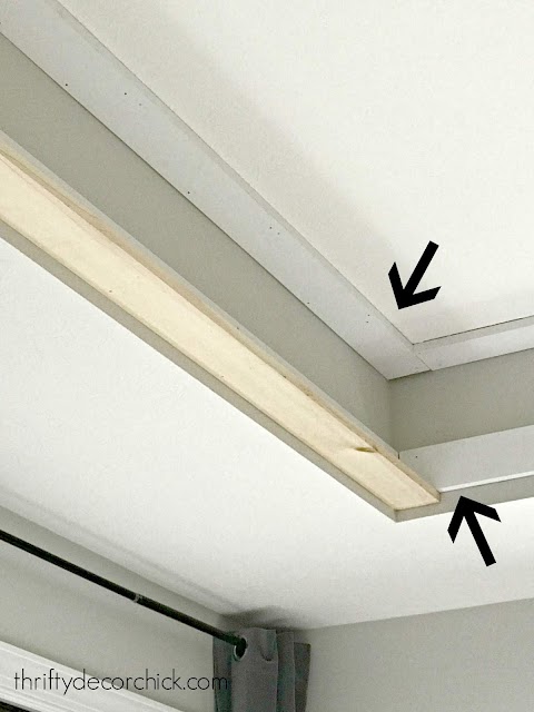 False wood beams on tray ceiling