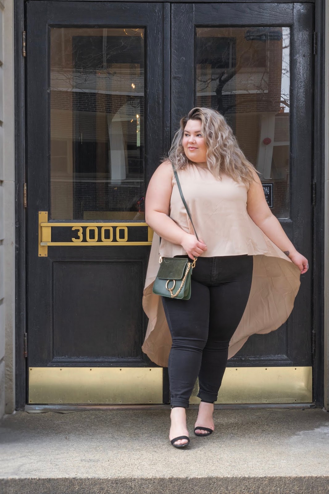 Chicago Plus Size Petite Fashion Blogger, YouTuber, and model Natalie Craig, of Natalie in the City, review's Fashion Nova's hi-lo tops and jeans.