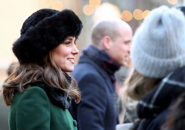 Kate Middleton wore a new bespoke Catherine Walker coat and dress. Duchess accessorised her coat with a faux fur collar and faux fur cuffs from Troy London