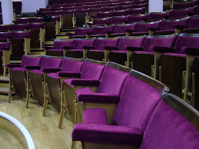auditorium in a traditional theatre with original seats which have been refurbished