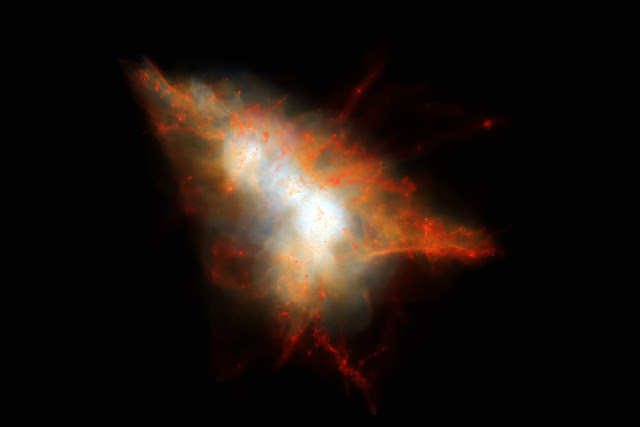 Hình ảnh mô phỏng một Đốm sáng Lyman-alpha, hay LAB-1. Đốm sáng bao gồm hai thiên hà ở trung tâm và được bao xung quanh bởi những dòng khí nóng và những thiên hà vệ tinh nhỏ hơn. Credit: J.Geach/D.Narayanan/R.Crain.