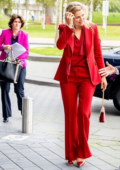Queen Maxima wore Claes Iversen LaPerm classic blazer and Lykoi trousers and Korat silk blouse. she carries Chanel red bag