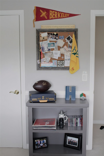 teen boy's room gray bookshelf wall decor bulletin board