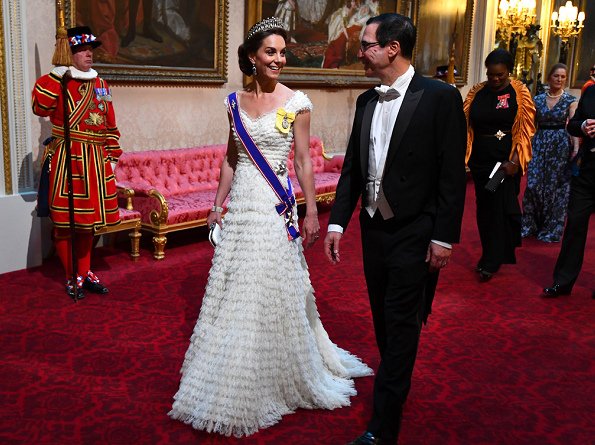 The Duchess wore a bespoke Alexander McQueen ruffled gown and Sapphires, Regalia and the Lover's Knot Tiara