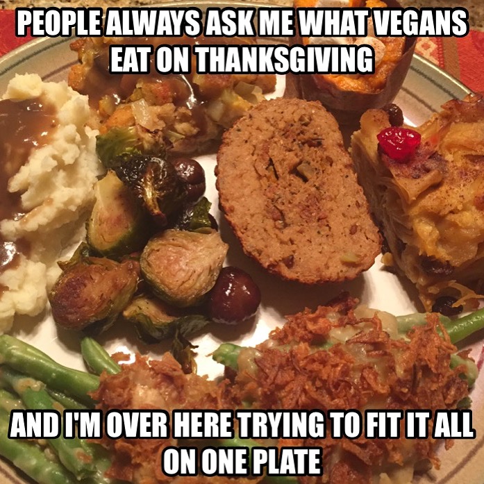 An image of a Thanksgiving dinner. Meme text at the top and bottom reads, "People always ask me what vegans eat on Thanksgiving and I'm over here trying to fit it all on one plate.