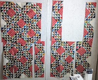 Two collaged photos show more progress in construction of the Ocean Waves quilt top