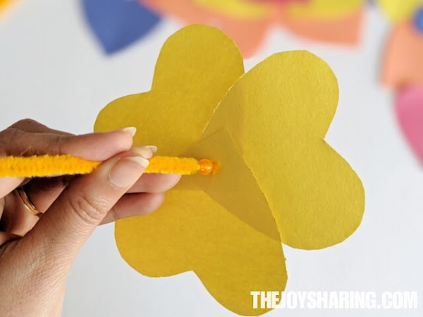 kids can use a bead in this craft to hold the flower petals.