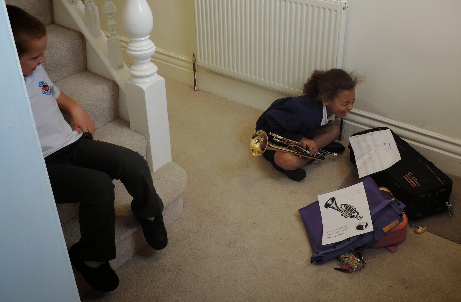schoolgirl learning trumpet laughs uncontrollably wimborne junior school trumpet lessons