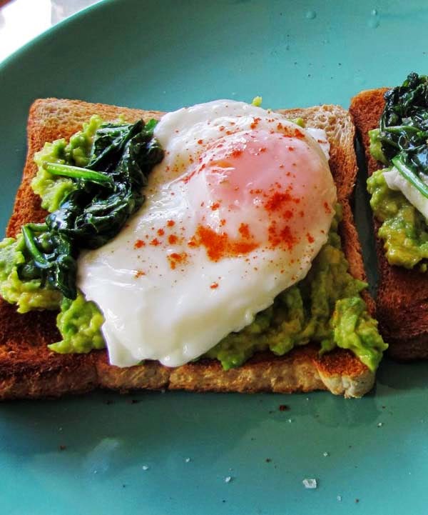 Open-Faced Toast with Poached Eggs, Mashed Avocado and Buttered Spinach. Simple Breakfast Idea To Use Leftovers.