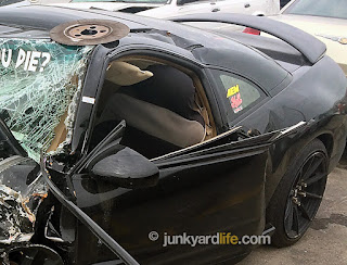 Seat is poking out driver’s side window.