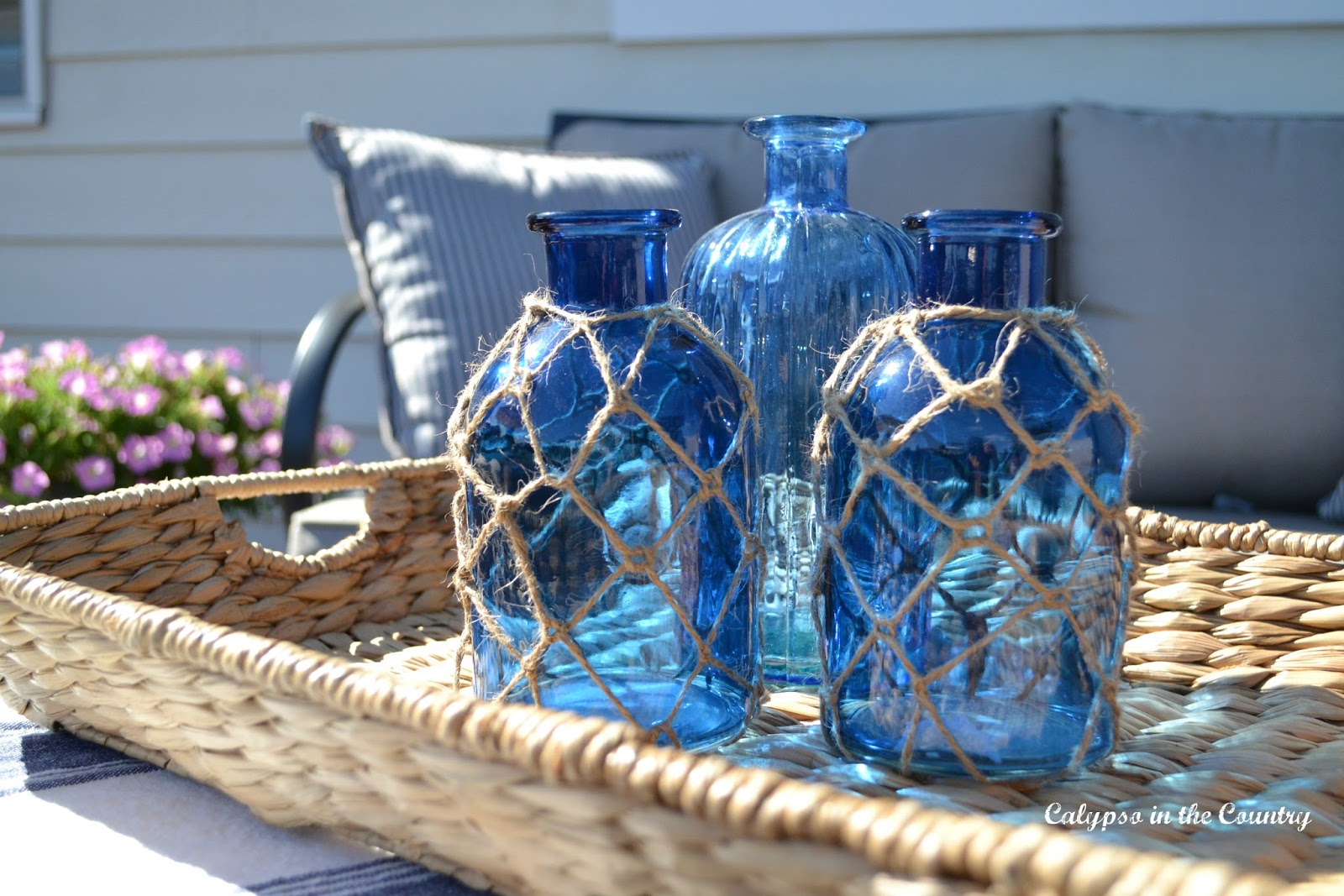 Blue coastal bottles on seagrass tray and other deck decor ideas