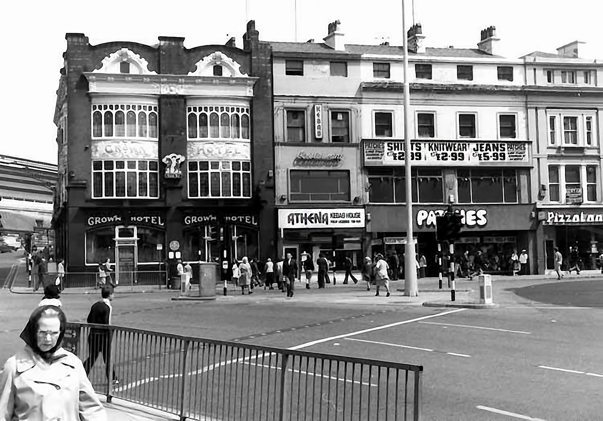 Looking uphill to the Crown Hotel on Lime Street, and the shops next door. Lime Street Station is just visible on the left.