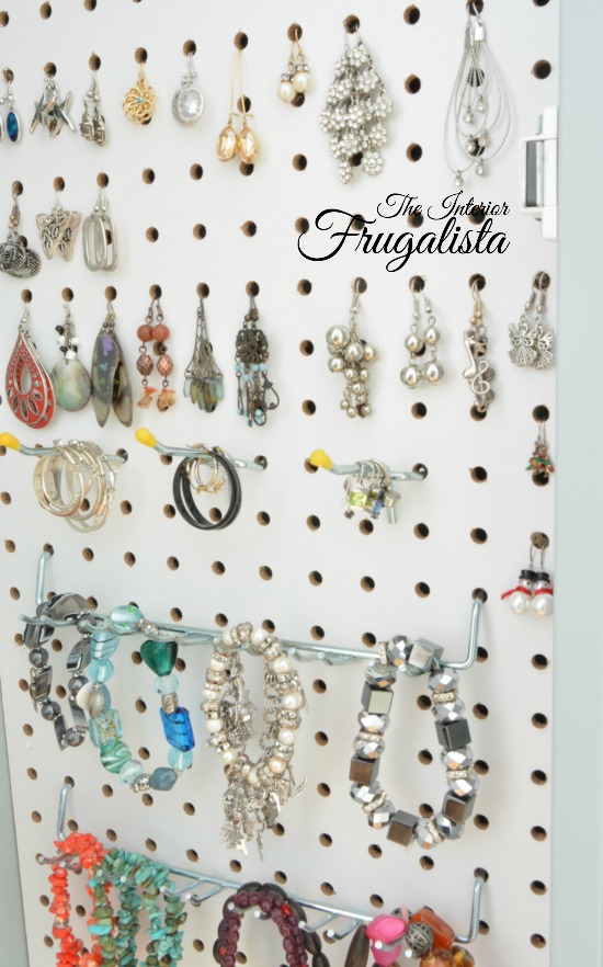 How to keep your jewelry organized and in one place with this DIY mirrored wall mount jewelry cabinet made with an inexpensive full-length mirror.