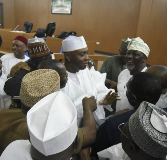 Photos: Excited Dino Melaye lifts up senate president, Bukola Saraki, moments after CCT cleared him of all false asset declaration charges