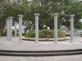 sculpture of dolphins bordered by classical columns in Jiangmen